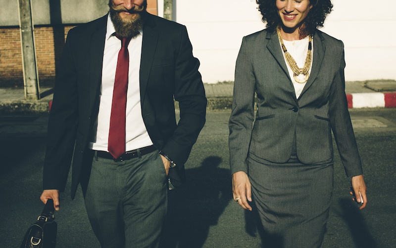 Man and woman walking together in business atire