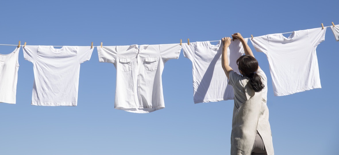 Woman hanging laundry on a line